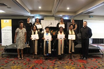 Cohort 14 graduates flanked by WINGS Rep Gou Kere, BCFW Executive Director Evonne Kennedy, Abt Associates rep Joy Waffi & PNGAA rep Kinivanagi Karo.